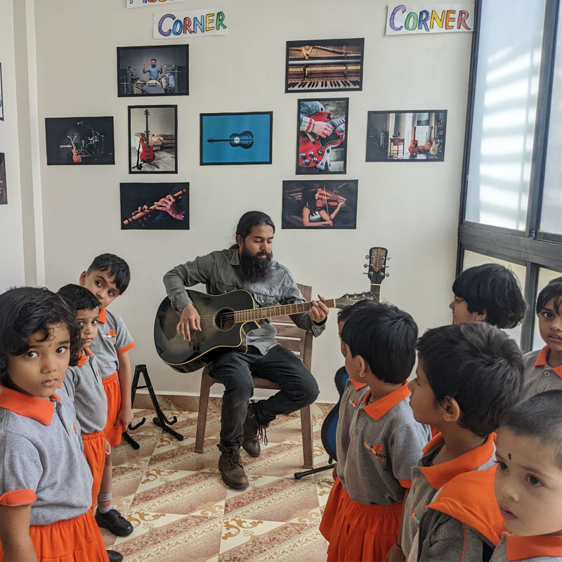 music class with guitar and students